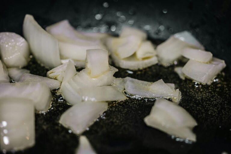 Deeply golden caramelized onions in a cast iron skillet